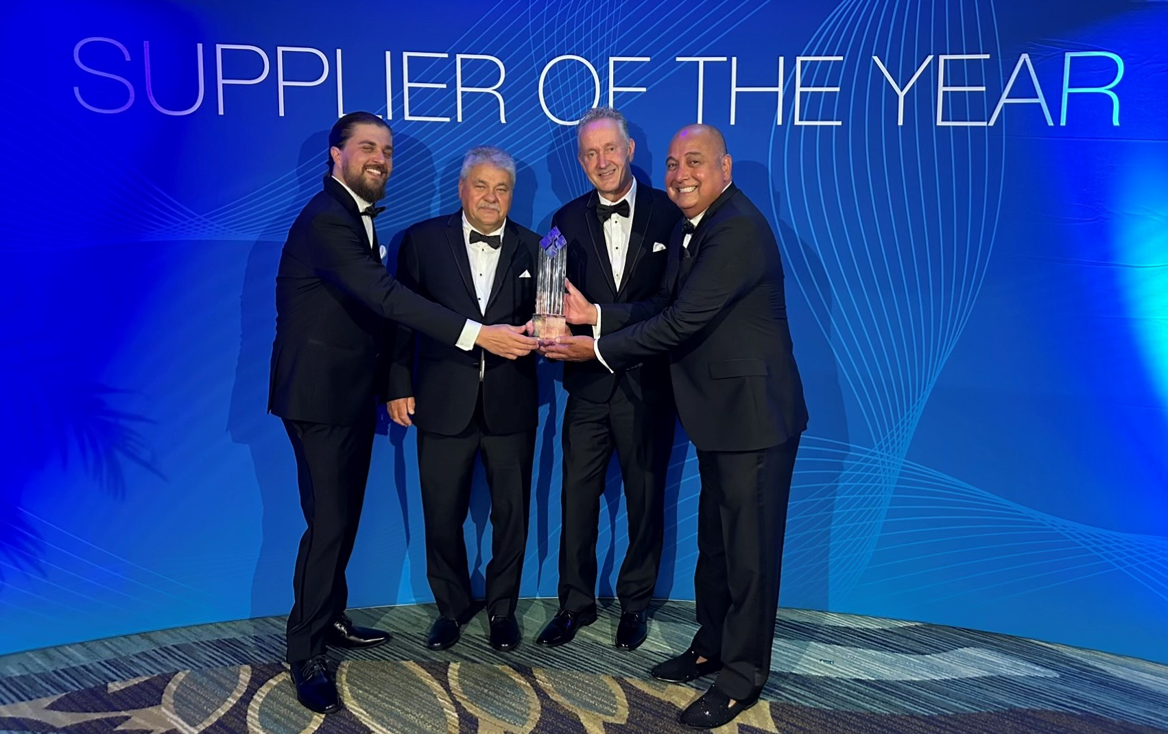 Management of Harper Engineering Co. receiving Supplier of the Year award at Boeing`s annual event.